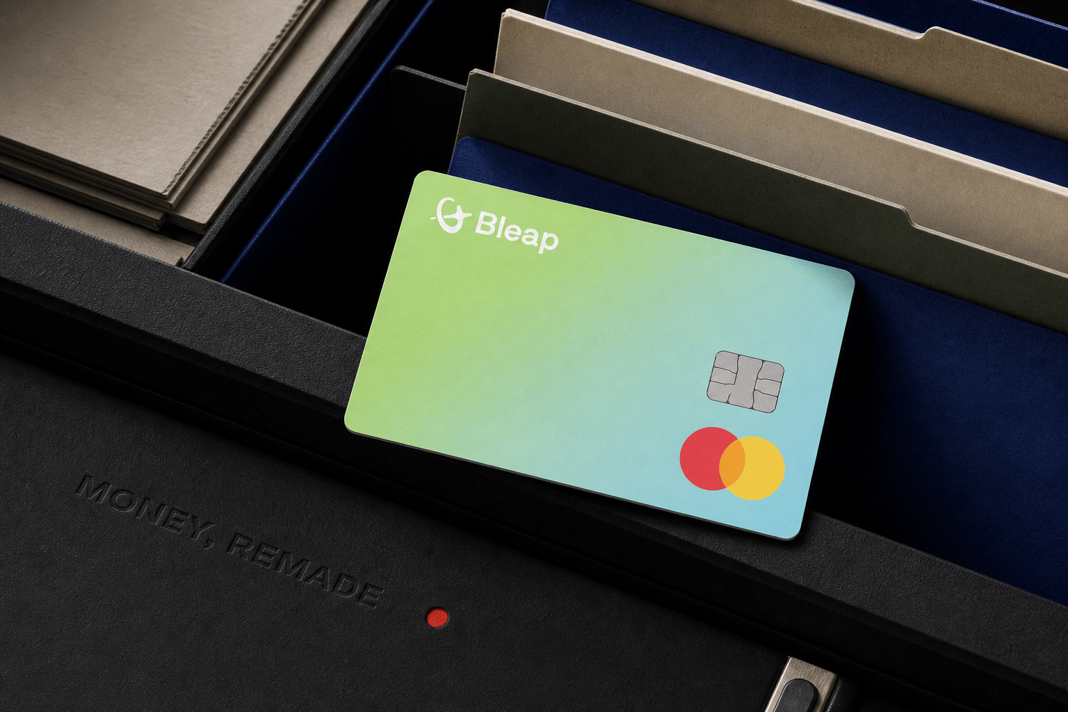 Bleap Card resting across a cobalt category index drawer with a recessed Money, Remade wordmark